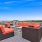 cushioned seating surround open fire pit on Roof-Top Terrace