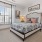large window in furnished bedroom