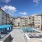 outdoor swimming pool area with cabanas and in-pool loungers