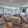 Theatre Room with poker table and surrounded by curtained windows